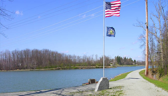 American and Pennsylvania flags on the path beside Ethel Springs Lake